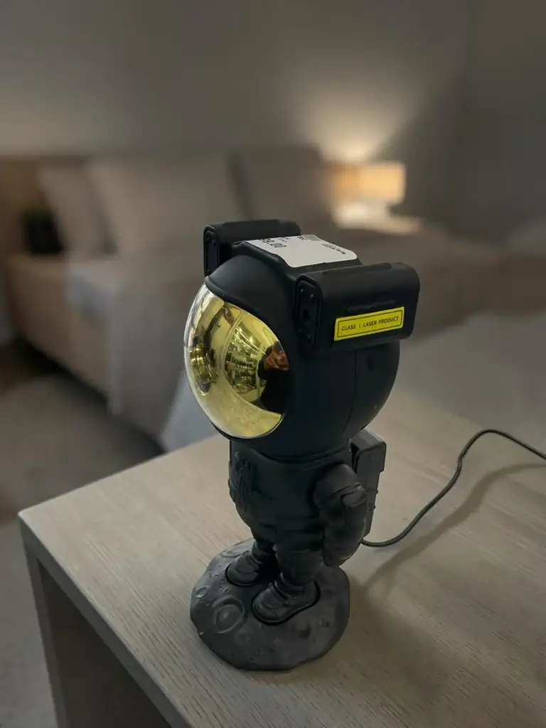 Black Astronaut Star Projector Light With Laser Effects